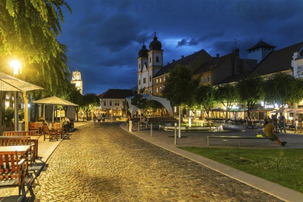 Night shot of the Peace Square in the old town centre of Trencín, in the background the Piarist Church of St. Francis Xavier, Capital of Culture 2026, Trencín, Slovakia