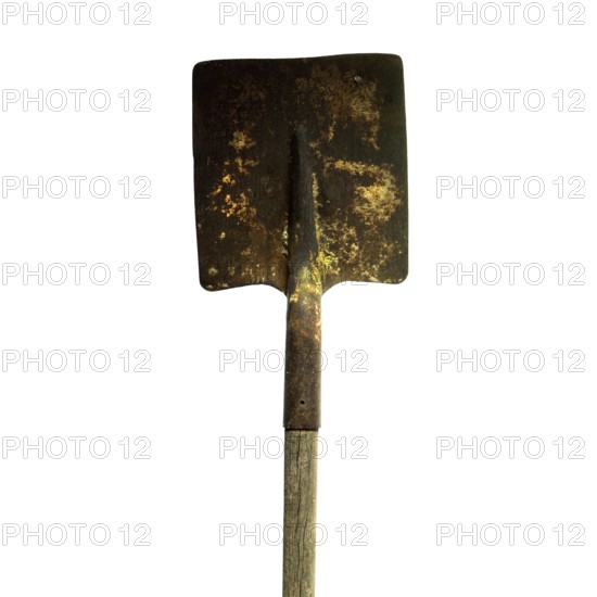 Old rusty spade stands vertically with a wooden handle, highlighting its weathered surface and signs of aging. This tool demonstrates the beauty of wear and practicality over time