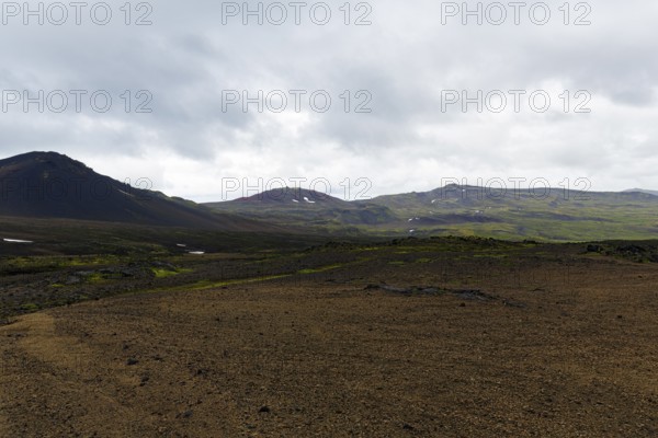 High plateau, barren volcanic landscape with snow fields, mountain peaks with rain clouds, Snaefellsjökull, Snæfellsnes peninsula, Snaefellsnes, West Iceland, Iceland