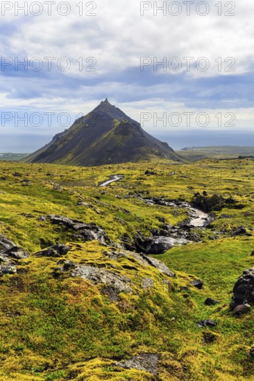 Barren moss-covered volcanic landscape, cone-shaped mountain Stapafell, Arnarstapi, Snæfellsjökull volcanic system, Snaefellsnes peninsula, West Iceland, Iceland