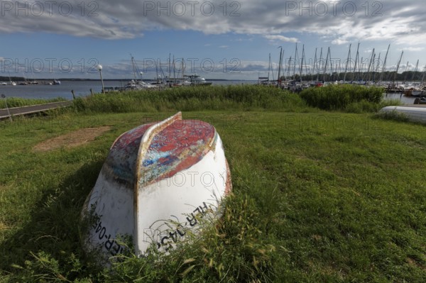 Boat with keel up, weathered paint in many colours, Jachthafen Baltic resort Rerik, Mecklenburg-Vorpommern, Germany