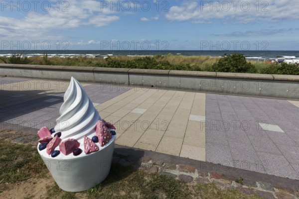 Decorative sundae with strawberries and icing on the cake, eye-catcher on the beach promenade, Baltic resort Kühlungsborn, Baltic Sea, Mecklenburg-Western Pomerania, Germany
