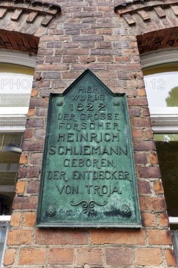 Plaque in the birthplace of Heinrich Schliemann, discoverer of Troy, Neubukow, district of Rostock, Mecklenburg-V, Germany