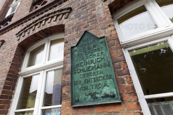 Plaque in the birthplace of Heinrich Schliemann, discoverer of Troy, Neubukow, district of Rostock, Mecklenburg-V, Germany