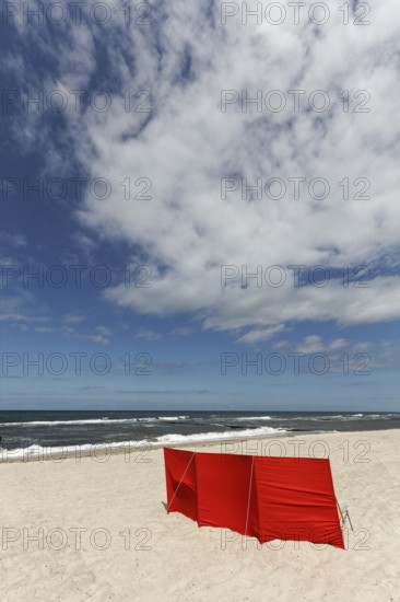 Lonely beach with red windbreak, blue sky, Baltic Sea near Kühlungsborn, Mecklenburg-Western Pomerania, Germany