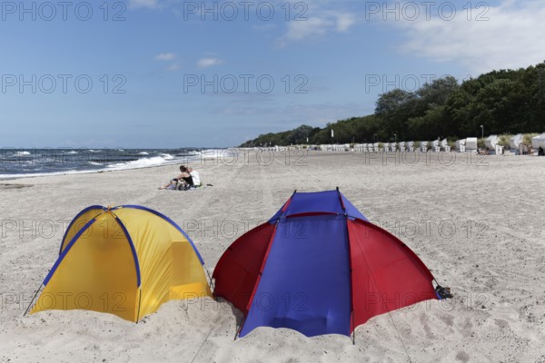 Two colourful beach shells, blue sky, Baltic Sea beach near Kühlungsborn, Mecklenburg-Western Pomerania, Germany
