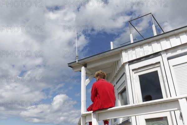 DLRG lifeguard at a rescue station, watching the beach, Kühlungsborn, Baltic Sea, Mecklenburg-Western Pomerania, Germany