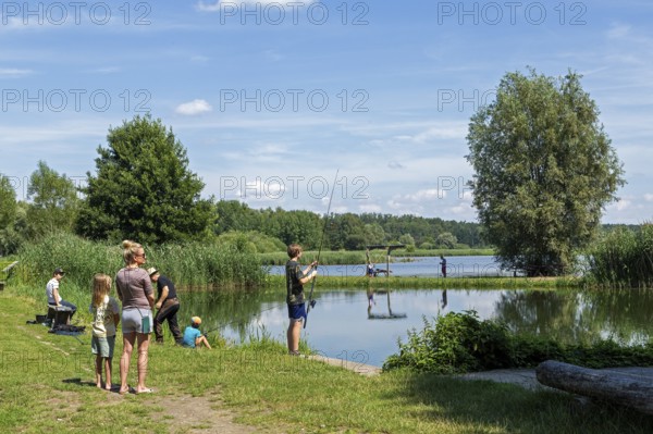 People fishing, fishing ponds, Fischers Land Boek, Mecklenburg Lake District, Mecklenburg-Western Pomerania, Germany