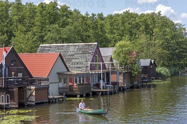 Canoeing, boathouses, holiday homes on the canal between Mirower See and Zotzensee, Mirow, Mecklenburg Lake District, Mecklenburg-Vorpommern, Germany