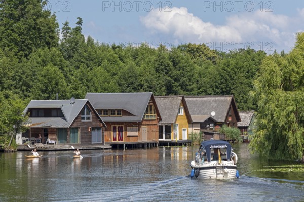 Boat, boathouses, holiday homes on the canal between Mirower See and Zotzensee, Mirow, Mecklenburg Lake District, Mecklenburg-Vorpommern, Germany