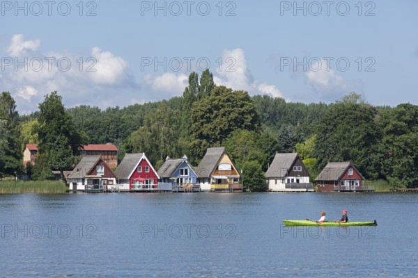 Boathouses, holiday homes on Lake Mirow, canoe, Mirow, Mecklenburg Lake District, Mecklenburg-Western Pomerania, Germany