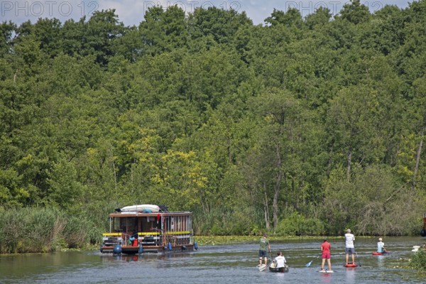 Houseboat, canoe, stand-up paddler, canal between Mirower See and Zotzensee, Mecklenburg Lake District, Mecklenburg-Vorpommern, Germany