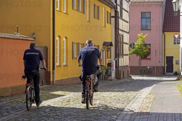 Employees, public order office, cycling to work, Röbel, Müritz, Mecklenburg Lake District, Mecklenburg-Western Pomerania, Germany