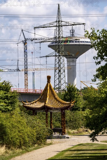 The Neulandpark in Leverkusen on the Rhine, state garden show site from 2005, Chinese dragon pavilion, Leverkusen water tower, landmark, high-voltage power lines, 20 hectares of parkland, with many playgrounds and sports fields, restaurants, hiking and cycling paths, south of the A1 motorway, North Rhine-Westphalia, Germany