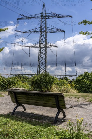 The Neulandpark in Leverkusen on the Rhine, state garden show site from 2005, vantage point, park bench directly in front of high-voltage power lines, 20 hectares of parkland, with many playgrounds and sports fields, restaurants, hiking and cycling paths, south of the A1 motorway, North Rhine-Westphalia, Germany