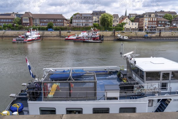 Barge, aft deck, with children's playground surrounded by a metal cage, for the safety of playing children, Ruhrort harbour, Duisburg, North Rhine-Westphalia, Germany