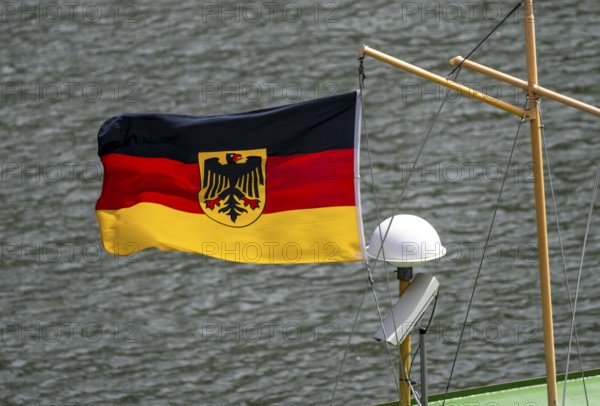 Federal coat of arms flag with federal eagle, service flag of the federal government and the Bundeswehr, here on a boat of the state water and shipping authority, Duisburg, North Rhine-Westphalia, Germany