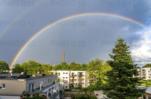 Rainbow after a thunderstorm over a residential neighbourhood in Essen-Rüttenscheid, North Rhine-Westphalia, Germany