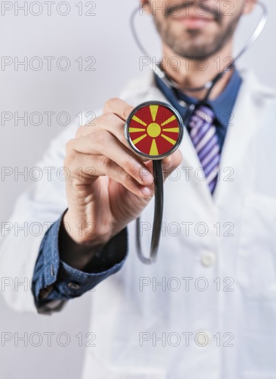 North Macedonia health and medical insurance concept. North Macedonia healthcare system, doctor holding stethoscope