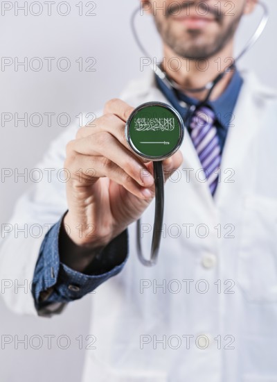 Saudi Arabia health and medical insurance concept. Saudi Arabia healthcare system, doctor holding stethoscope