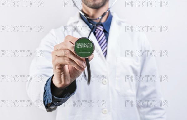 Saudi Arabia healthcare system, doctor holding stethoscope. Saudi Arabia health and medical insurance concept