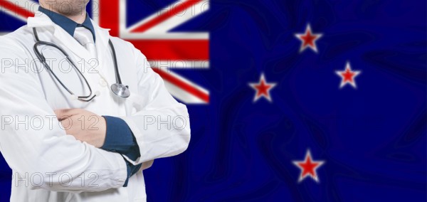 New Zealand healthcare concept. Male doctor on New Zealand flag. Doctor with crossed arms on New Zealand flag