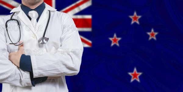 Male doctor with stethoscope on New Zealand flag. Doctor holding stethoscope on New Zealand flag