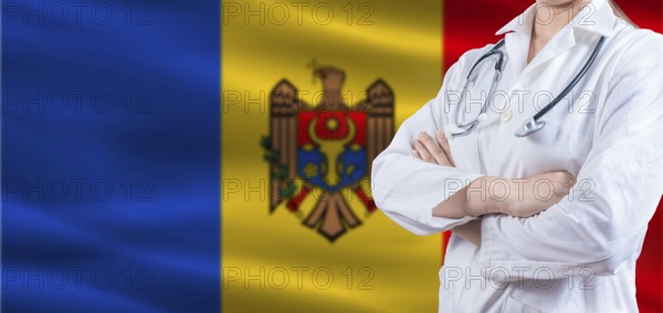 Doctor with crossed arms on Moldova flag. Moldova health and care concept. Female doctor on Moldova flag