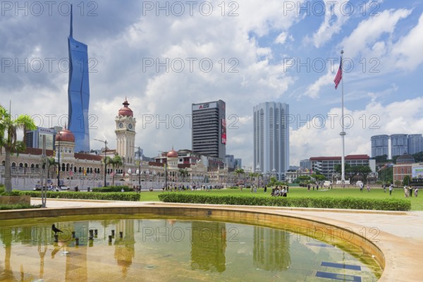 Skyscrapers reflecting in Merdeka square pond, Kuala Lumpur, Malaysia, Asia
