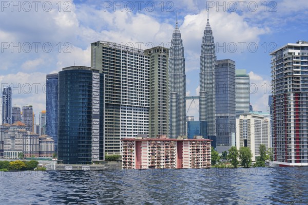 Kuala Lumpur city skyline seen from an infinity pool, Malaysia, Asia