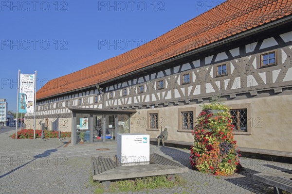 Entrance to the arms museum built in 1668, half-timbered house, flag, banner, museum, Suhl, Franconia, Thuringia, Germany