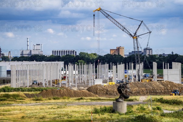 Construction of a new logistics hall on the Mercatroinsel, Hall 2, next to an existing hall, approx. 25, 000 square metres in size, in Duisburg-Ruhrort, shell construction, sculpture The Echo of Poseidon on the Rhine, North Rhine-Westphalia, Germany