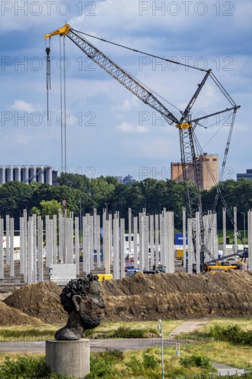 Construction of a new logistics hall on the Mercatroinsel, Hall 2, next to an existing hall, approx. 25, 000 square metres in size, in Duisburg-Ruhrort, shell construction, sculpture The Echo of Poseidon on the Rhine, North Rhine-Westphalia, Germany