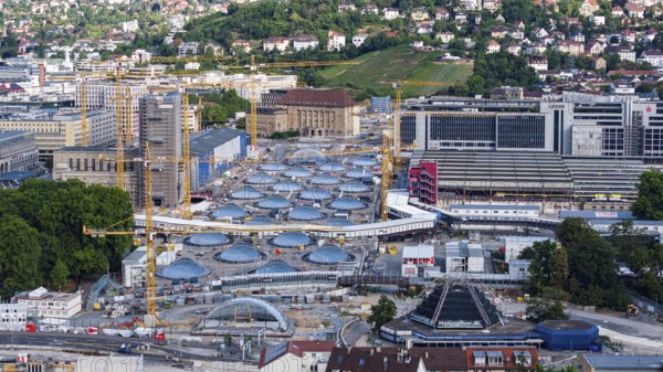 Stuttgart Central Station. The Stuttgart 21 construction site, where the new through station is being built. The 27 skylights, which naturally illuminate the future through station, are a characteristic feature. On the right are the current platforms of the terminus station. Stuttgart, Baden-Württemberg, Germany