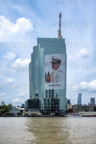 Tower block National Telecom Public Company Limited with image of Thailand King Maha Vajiralongkorn, Bangkok, Thailand