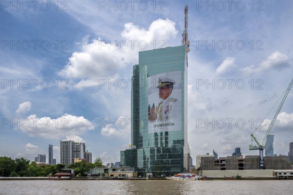 Tower block National Telecom Public Company Limited with image of Thailand King Maha Vajiralongkorn, Bangkok, Thailand