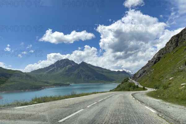 Well developed pass road mountain road to pass summit of alpine pass Col du Mont Cenis, on the left reservoir Lac du Mont Cenis, in the sky Altocumulus clouds, Mont Cenis massif, Massif du Mont-Cenis, Graian Alps, Lanslebourg, Rhone-Alpes, France