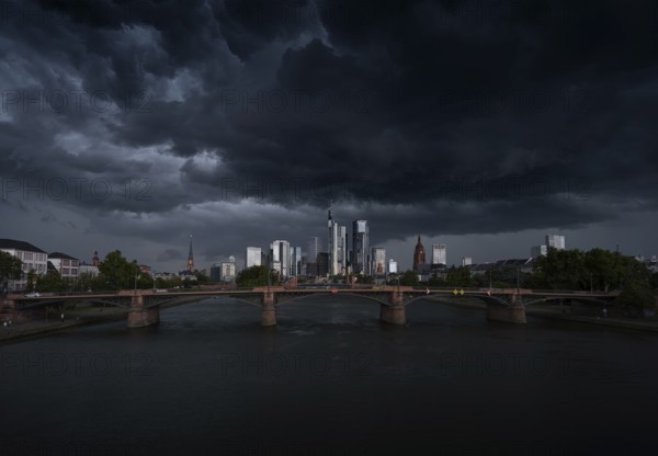 A storm passes over the Frankfurt banking skyline with gloomy clouds, Frankfurt am Main, Hesse, Germany