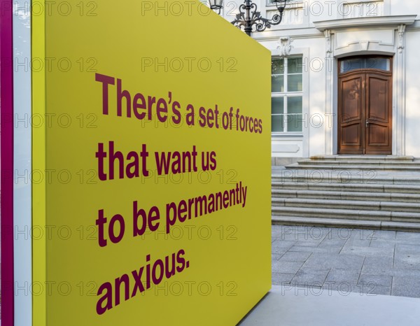 Tony Cokes, visual artist and educator, display panel at the Palais Populaire Unter den Linden, Berlin, Germany