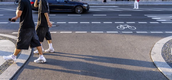 Road traffic and pedestrians on the carriageway in Berlin-Mitte, Unter den Linden, Berlin, Germany
