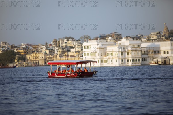 Excursion boat on Lake Pichola, behind the old town, Udaipur, Rajasthan, India