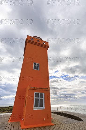 Orange lighthouse Skálasnagaviti or Svörtuloft with wooden boardwalk, Skalasnagi, Öndverdarnes, Snæfellsnes peninsula, Snaefellsnes, Iceland