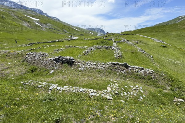 Foundation walls ruins of 2000 year old historical ancient Roman hostel Mansio at the top of the Alpine pass Colle del Piccolo San Bernardo, Col du Petit Saint Bernard Little Saint Bernard Pass in Alps, Aosta Valley region, Italy
