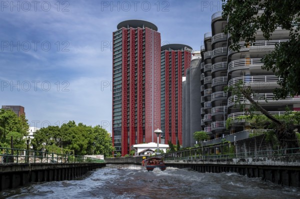 High-rise building on the canal, Bangkok, Thailand