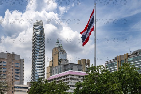 Thailand flag and Magnolias Ratchadamri Boulevard Residence, Bangkok, Thailand