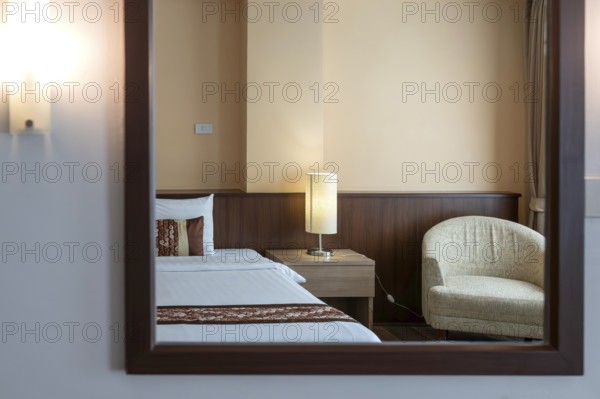 Symbol photo hotel room mirror bed