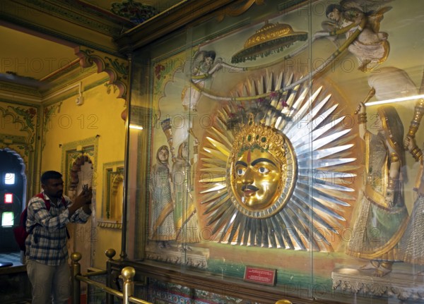 Mewad kingdom mask, sun god symbol in the City Palace Museum, City Palace of Udaipur, Rajasthan, India