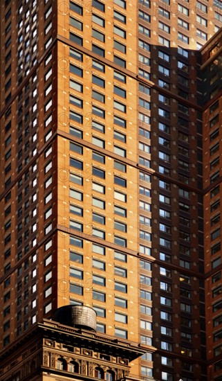 Skyscraper facades, below a wooden water tank on the roof of a residential building, New York Ciuty, USA