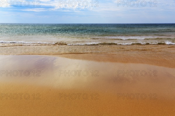 Orange-red lonely beach Raudisandur, sand, turquoise blue sea, Rauðisandur, coastline near Patreksfjördur, Vestfirðir, Westfjords, Iceland