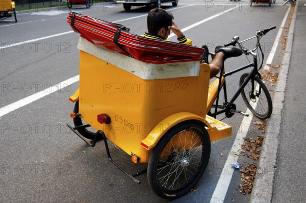 Waiting rickshaw driver at Central Park, New York City, USA